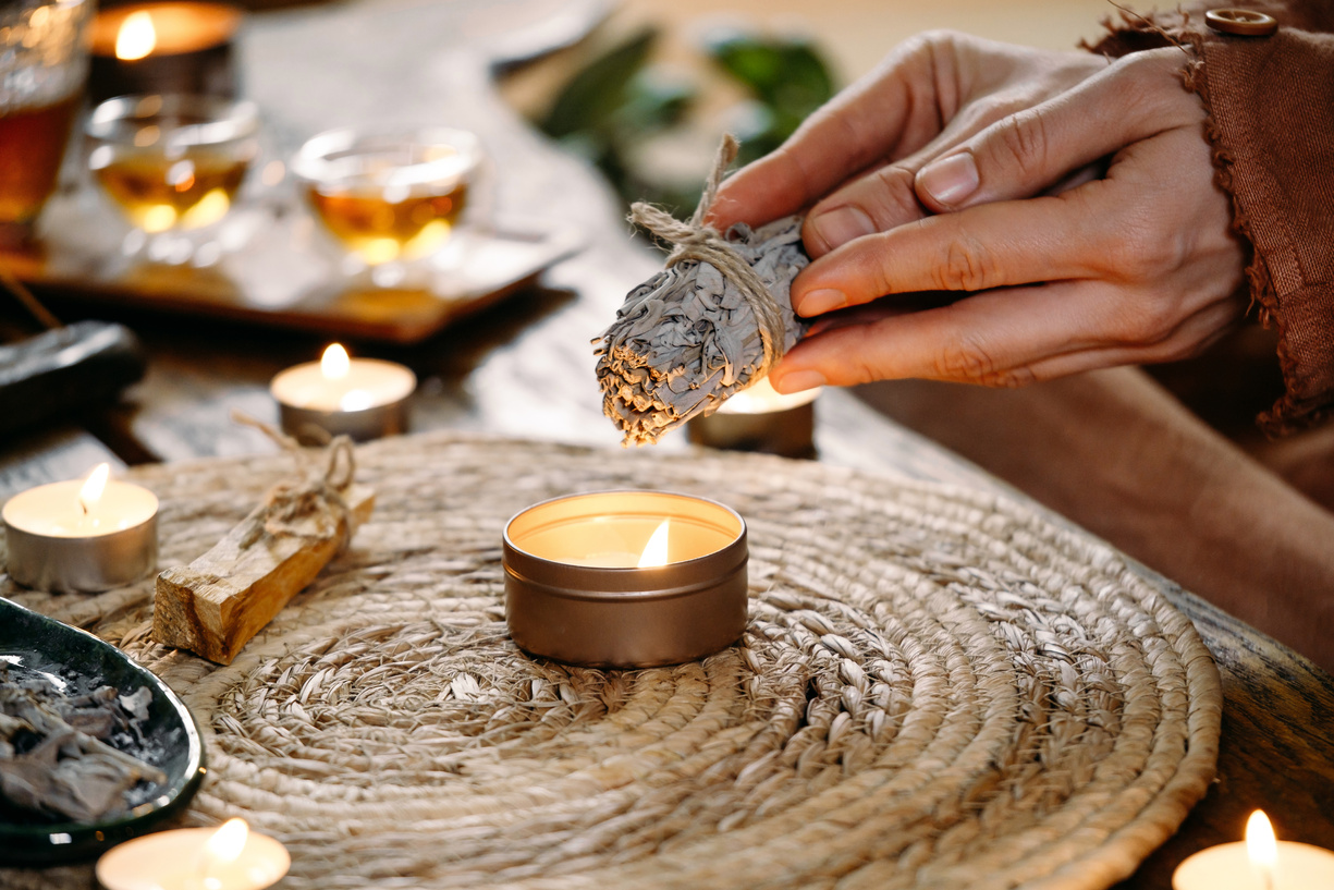 Woman Hands Burning White Sage, before Ritual on Cadle